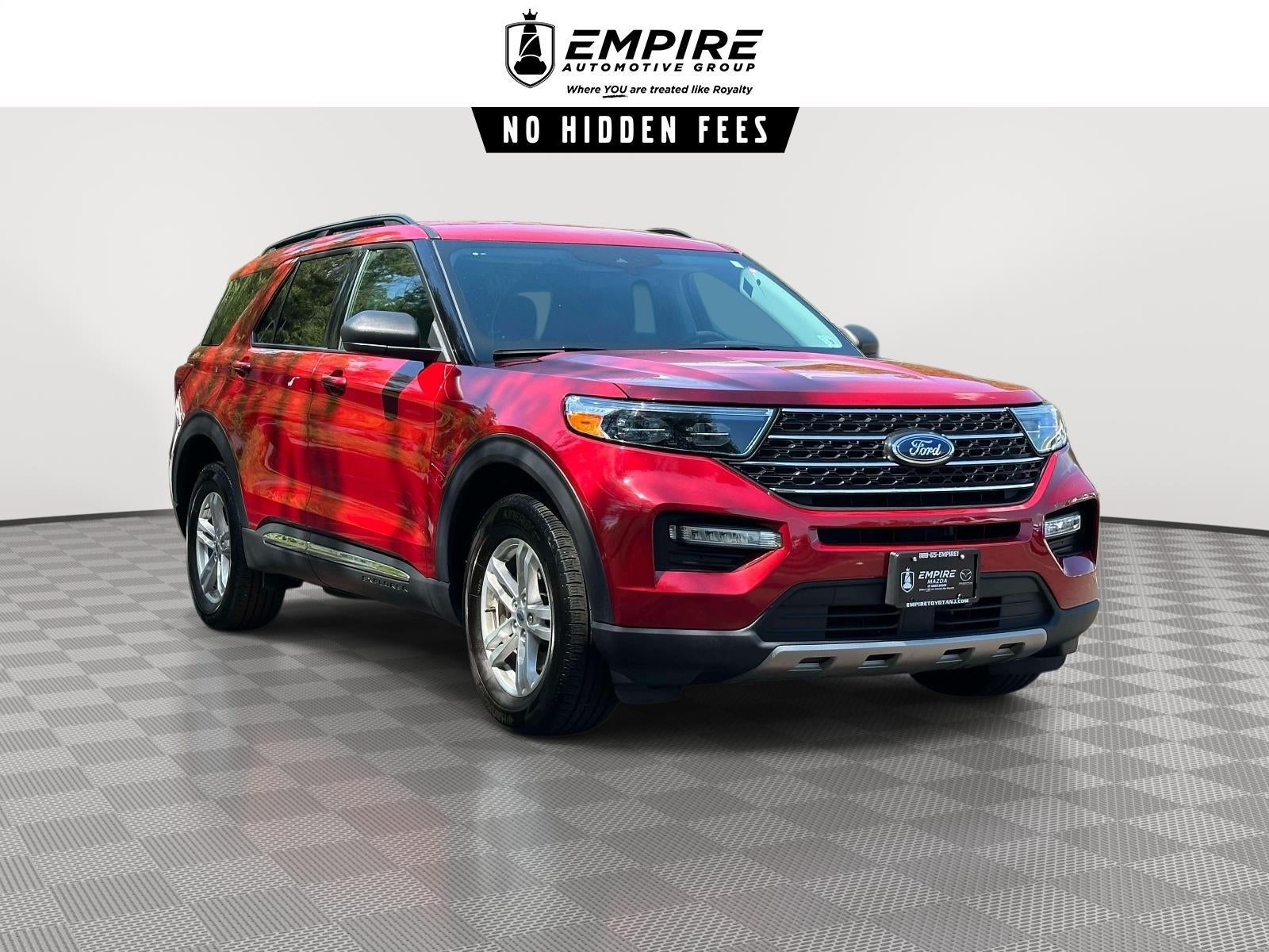 2023 Ford Explorer XLT in Rapid Red Met Tinted Cc — front three-quarter view