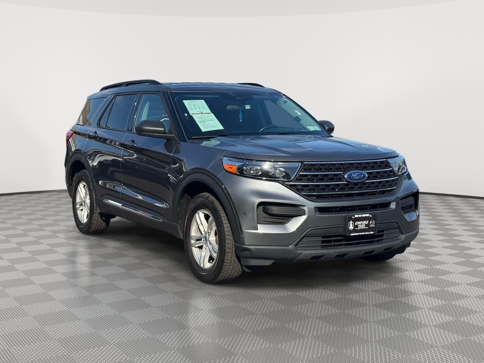 2023 Ford Explorer XLT in Carbonized Gray Metallic — front three-quarter view