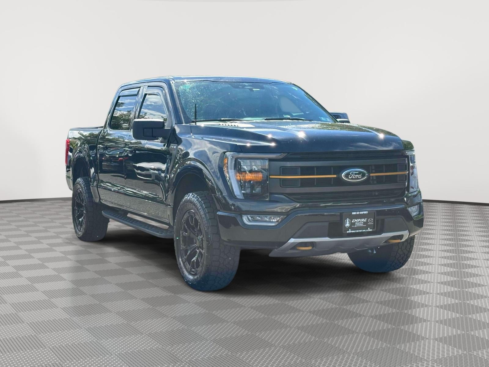 2023 Ford F-150 Tremor in Agate Black Metallic — front three-quarter view
