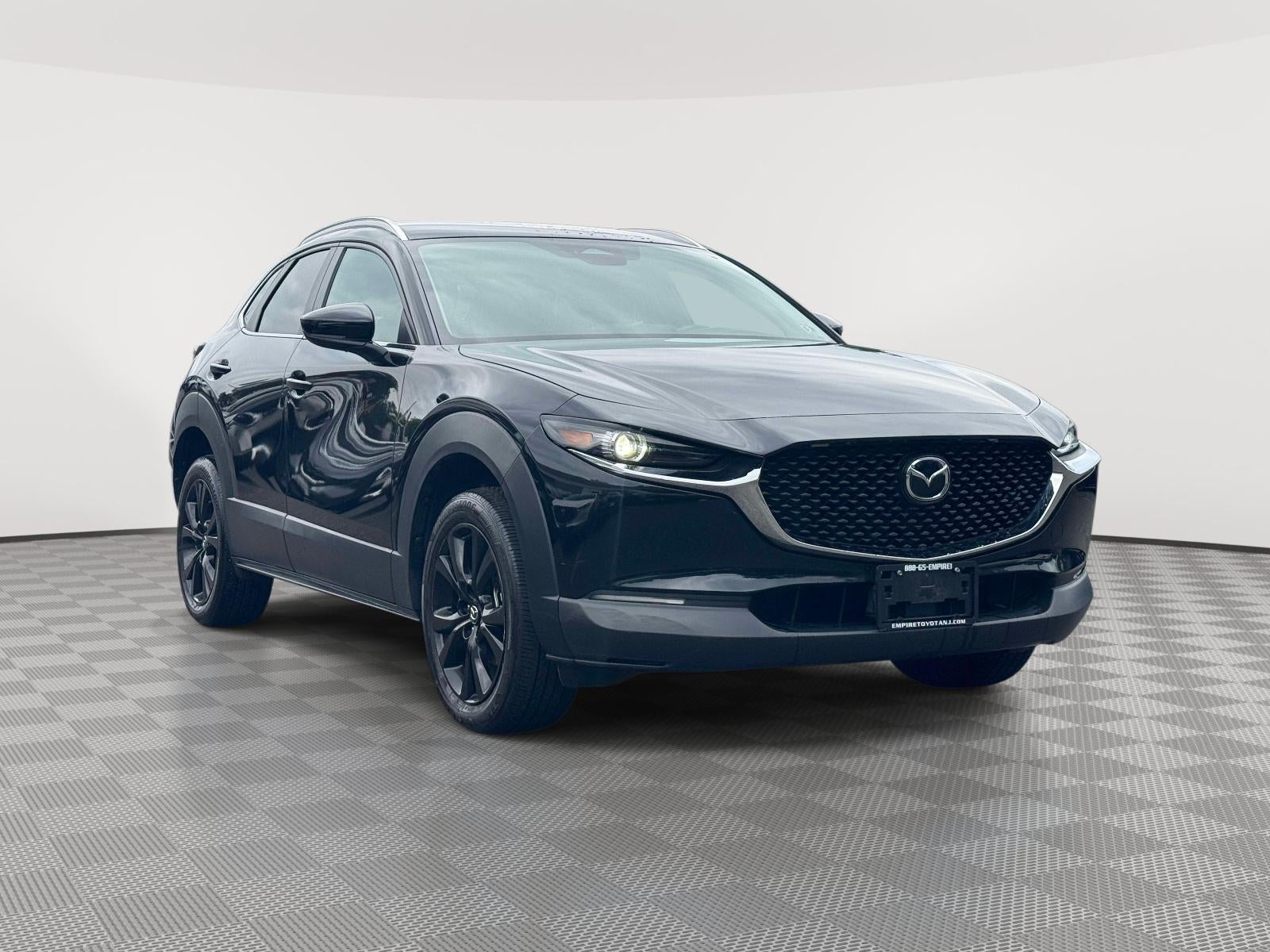 2024 Mazda Mazda CX-30 2.5 S Select Sport in Jet Black Mica — front three-quarter view