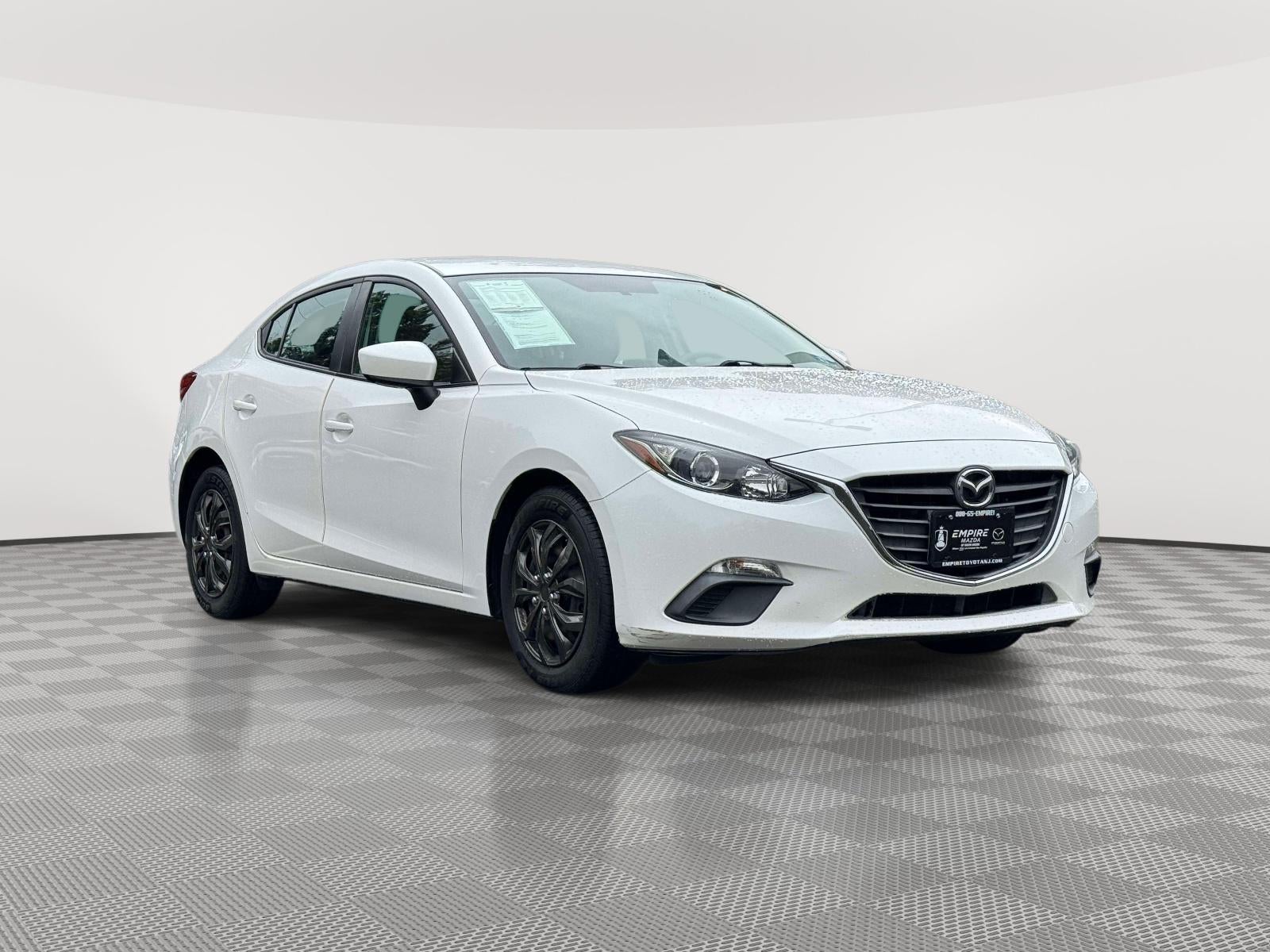 2015 Mazda Mazda3 i Sport in Snowflake White Pearl Mica — front three-quarter view