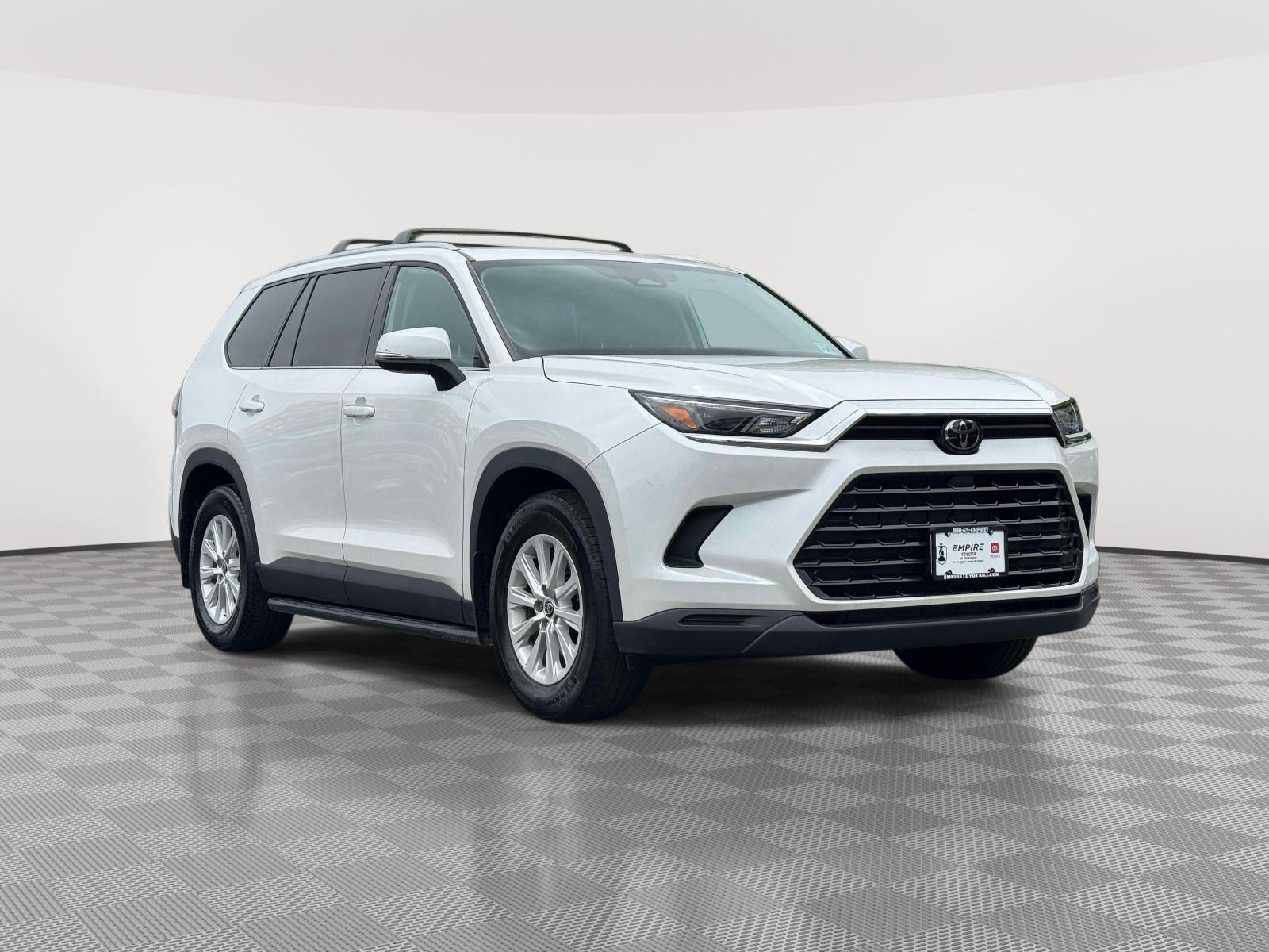 2024 Toyota Grand Highlander XLE in Wind Chill Pearl — front three-quarter view