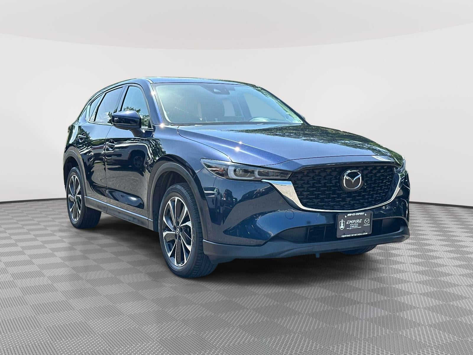 2023 Mazda Mazda CX-5 2.5 S Premium Plus in Deep Crystal Blue Mica — front three-quarter view