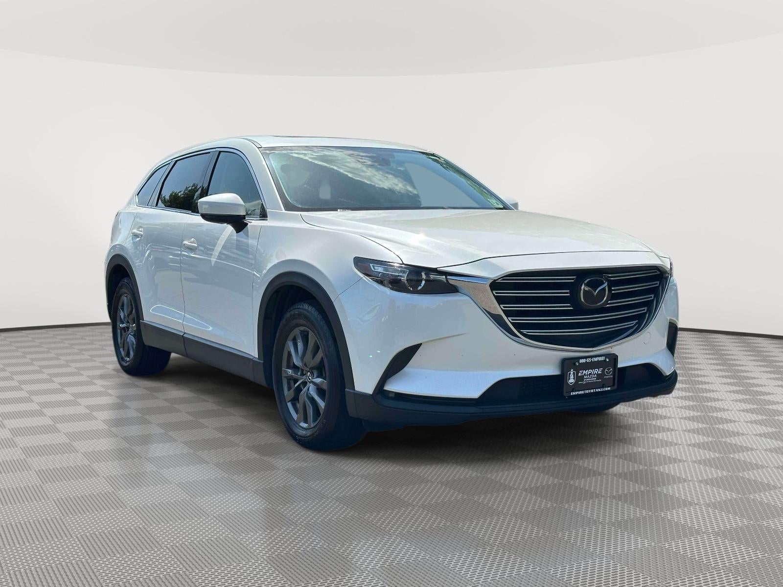 2023 Mazda Mazda CX-9 Touring in Snowflake White Pearl Mica — front three-quarter view
