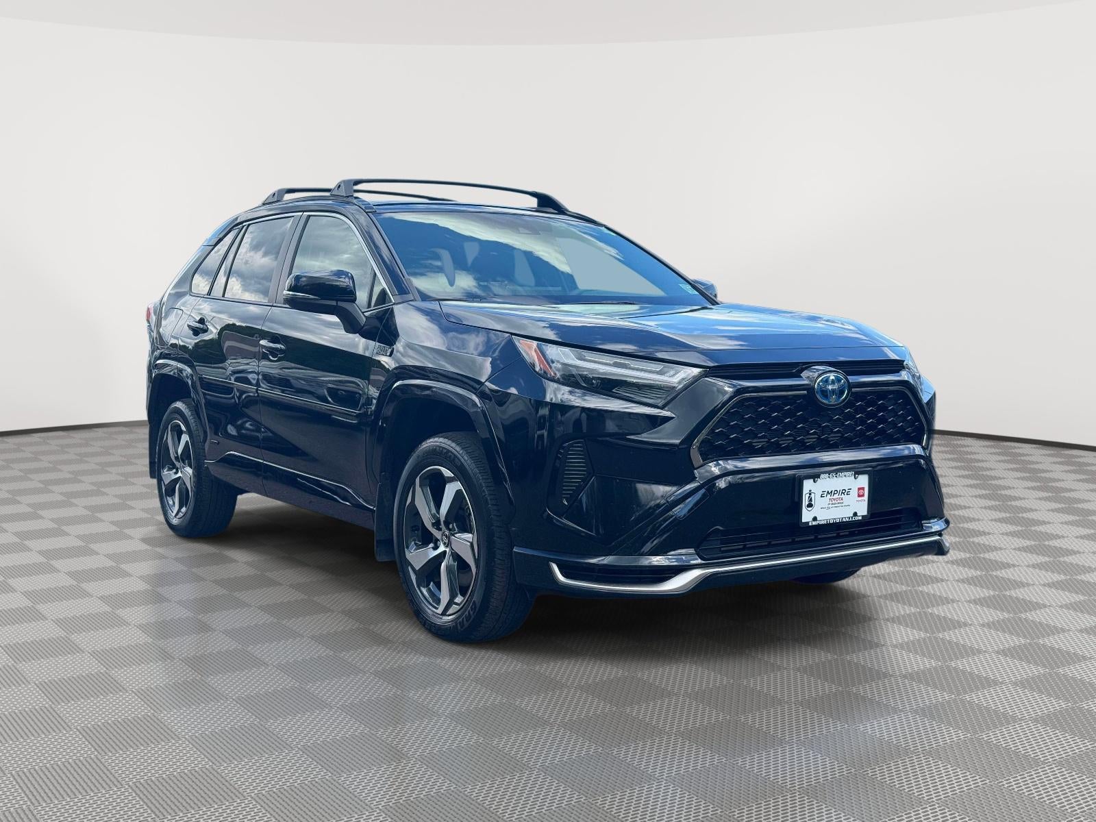2024 Toyota RAV4 Prime SE in Midnight Black Metallic — front three-quarter view